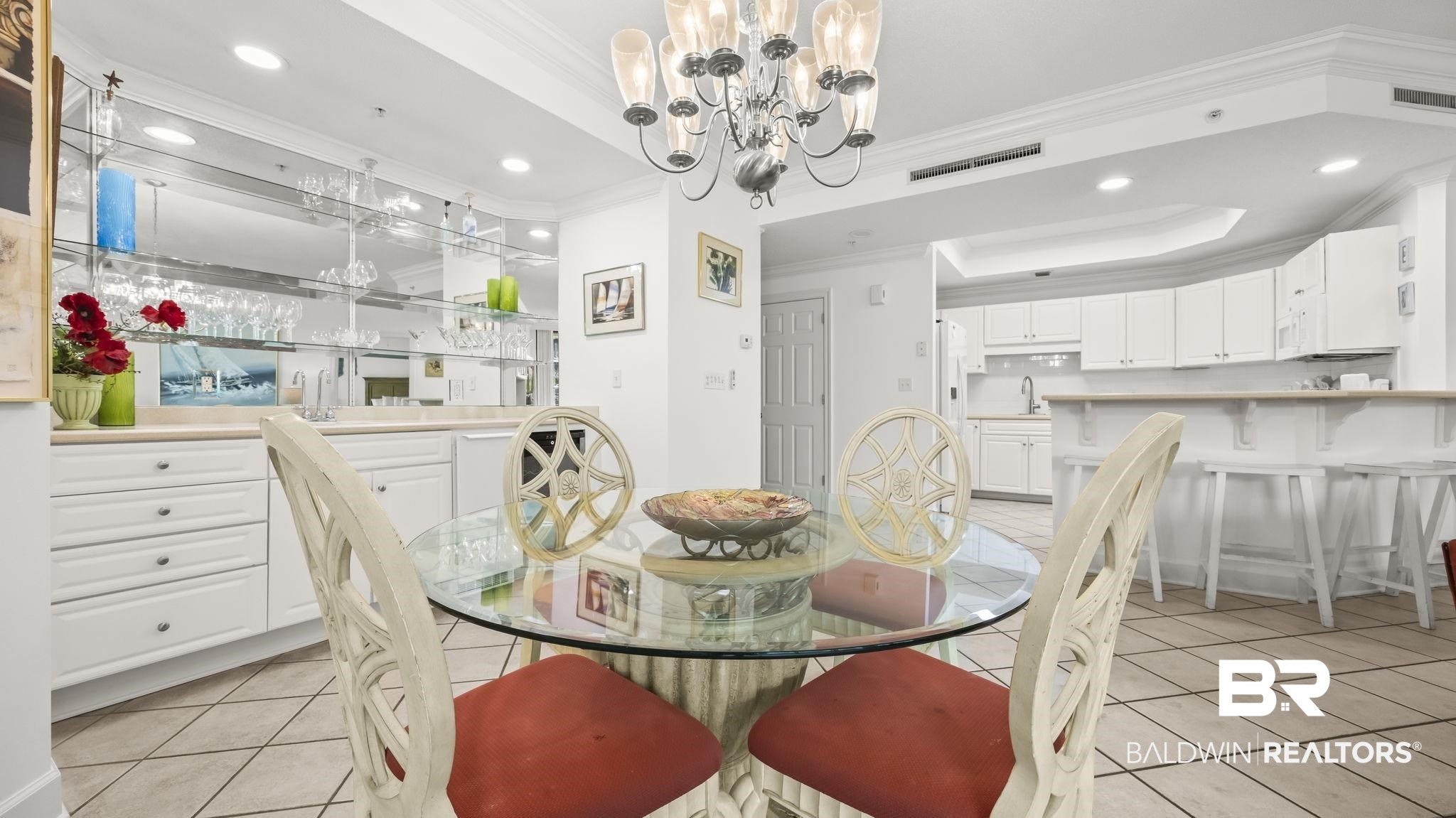 27580 Canal Road, Unit 1213 Orange Beach, AL 36561 - Photo 4 of 27 Dining area featuring a contemporary chandelier and tile flooring