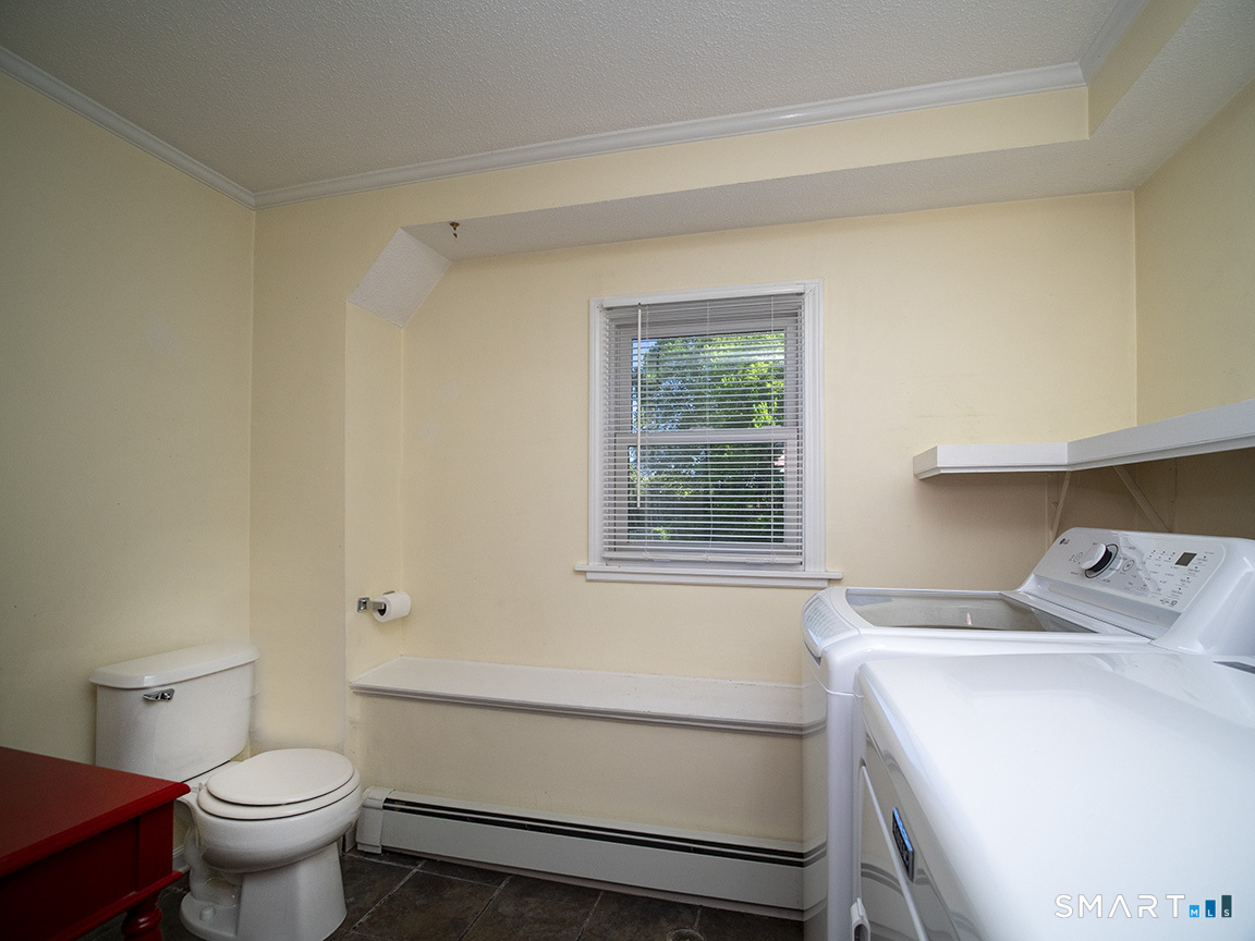 82 Wilcox Road Middletown, CT 06457 - Photo 23 of 27 a bathroom with a sink toilet vanity and window
