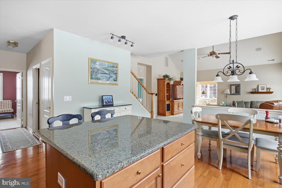 44 Mitchell Court Marlton, NJ 08053 - Photo 45 of 46 a kitchen with stainless steel appliances granite countertop a sink counter space and dining table