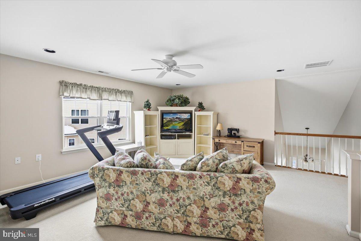 44 Mitchell Court Marlton, NJ 08053 - Photo 26 of 46 a living room with furniture and a chandelier