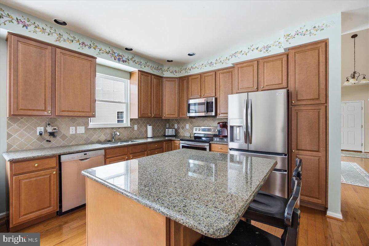 44 Mitchell Court Marlton, NJ 08053 - Photo 9 of 46 a kitchen with granite countertop a counter space cabinets stainless steel appliances and a window