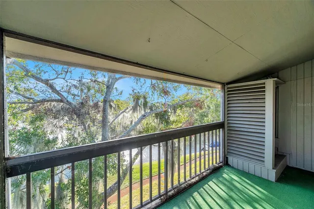 a bathroom with a granite countertop sink a toilet a mirror a vanity a bathtub and shower