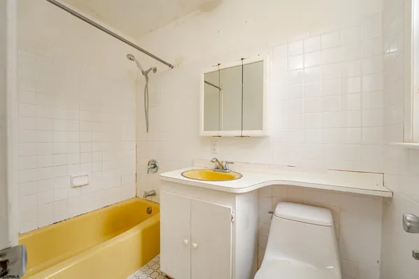 a bathroom with a sink and a bathtub