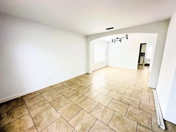 a view of an empty room with a bathroom