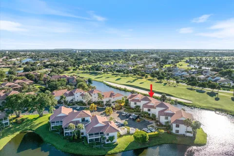 an aerial view of residential houses with outdoor space and swimming pool