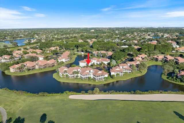 an aerial view of a house with a lake view