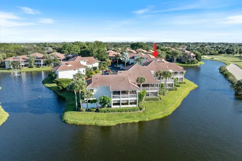 a view of a house with outdoor space and lake view