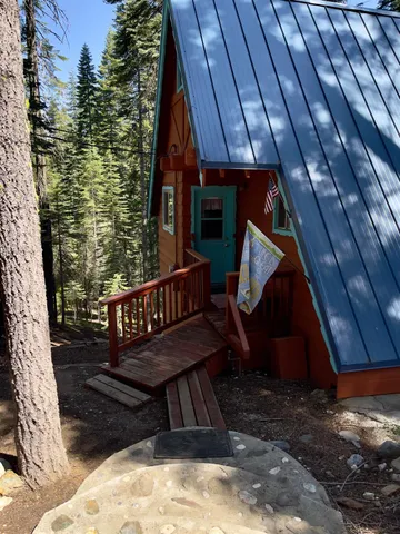 a view of balcony with wooden floor and outdoor seating