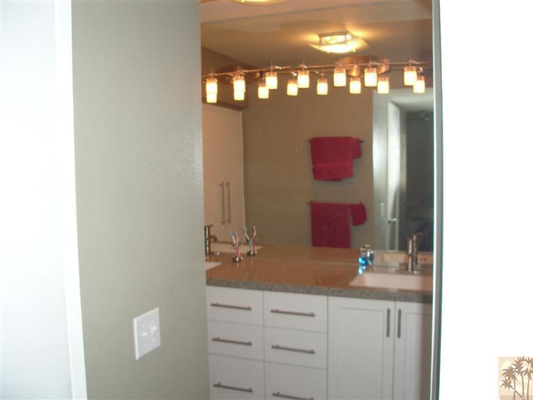 1717 East Sonora Road Palm Springs, CA 92264 - Photo 13 of 25 a bathroom with a sink and a mirror