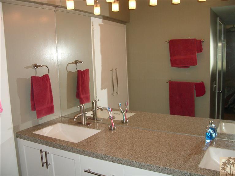 1717 East Sonora Road Palm Springs, CA 92264 - Photo 14 of 25 a bathroom with a sink vanity and a mirror