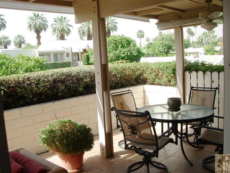 1717 East Sonora Road Palm Springs, CA 92264 - Photo 17 of 25 a view of a patio with table and chairs and potted plants