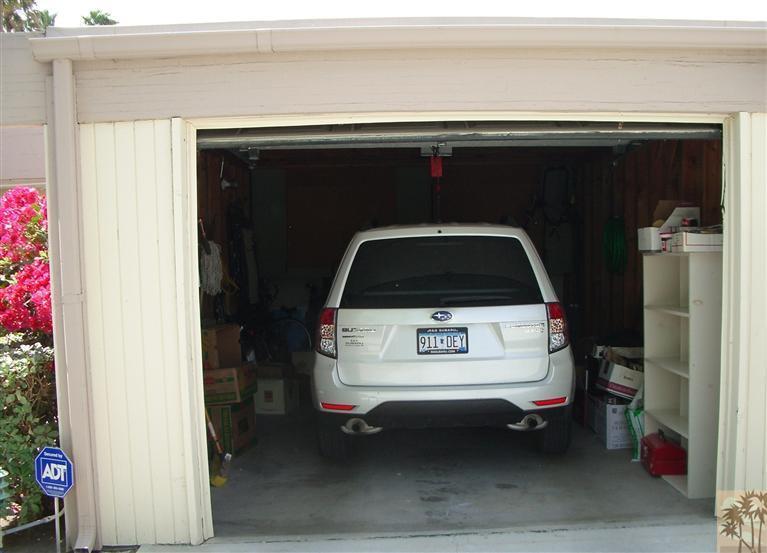 1717 East Sonora Road Palm Springs, CA 92264 - Photo 25 of 25 a utility room with a car parked car