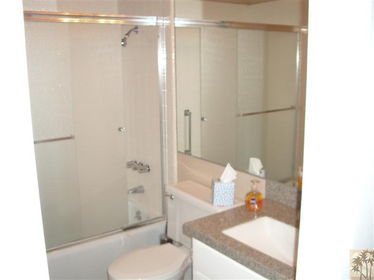 1717 East Sonora Road Palm Springs, CA 92264 - Photo 9 of 25 a bathroom with a sink toilet and shower