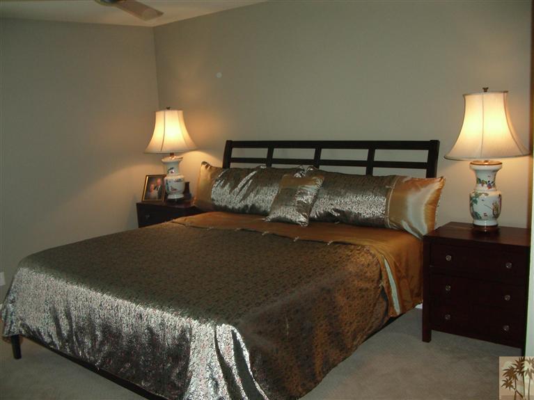 1717 East Sonora Road Palm Springs, CA 92264 - Photo 10 of 25 a bedroom with a bed and a lamp
