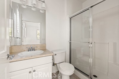 20332 Paseo Meriana Porter Ranch, CA 91326 - Photo 17 of 19 a bathroom with a granite countertop sink toilet and shower