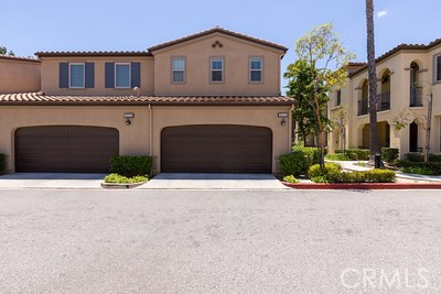20332 Paseo Meriana Porter Ranch, CA 91326 - Photo 18 of 19 a front view of a house with yard and parking space