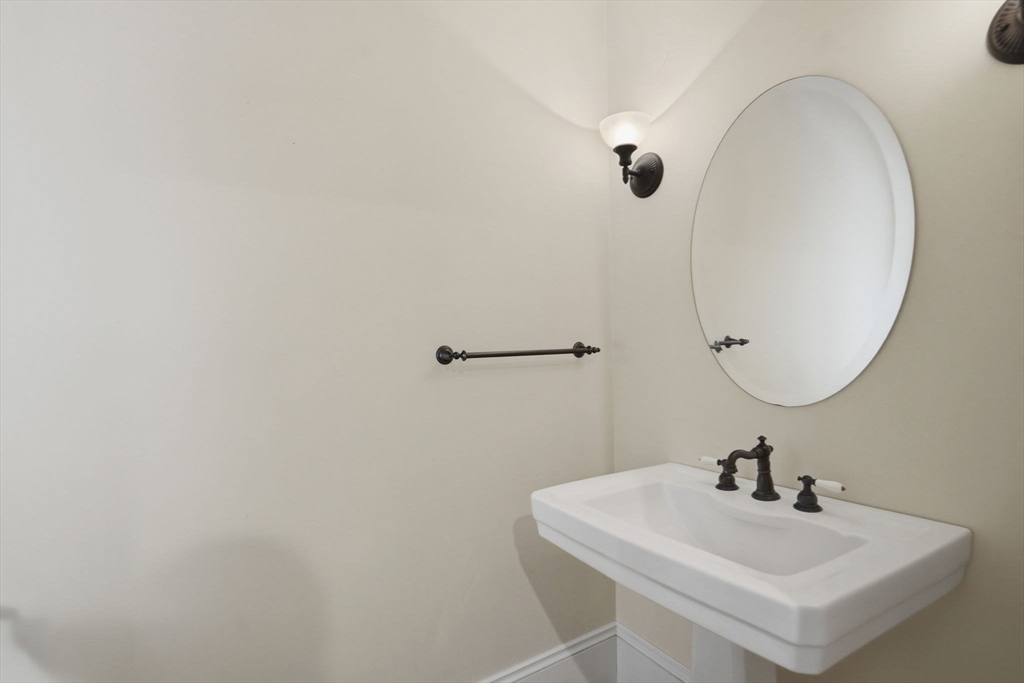 151 Amity Street, Unit 2 Amherst, MA 01002 - Photo 13 of 42 a bathroom with a sink and mirror