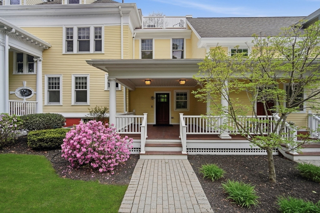 151 Amity Street, Unit 2 Amherst, MA 01002 - Photo 2 of 42 a front view of a house with a garden