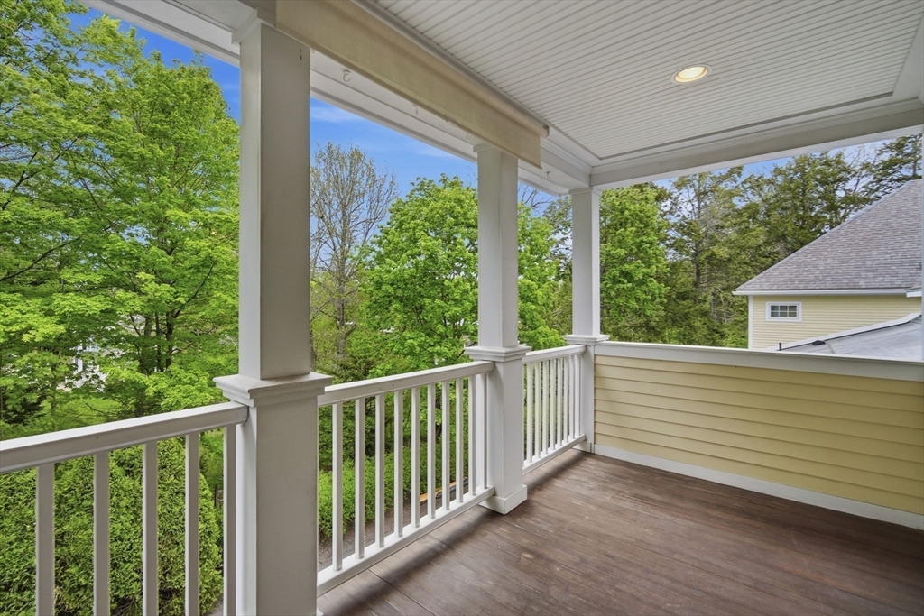 151 Amity Street, Unit 2 Amherst, MA 01002 - Photo 22 of 42 a view of a balcony with wooden floor