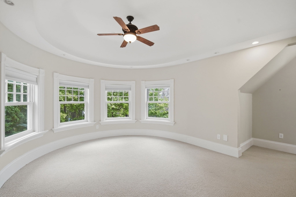 151 Amity Street, Unit 2 Amherst, MA 01002 - Photo 24 of 42 a view of a livingroom with a ceiling fan and window