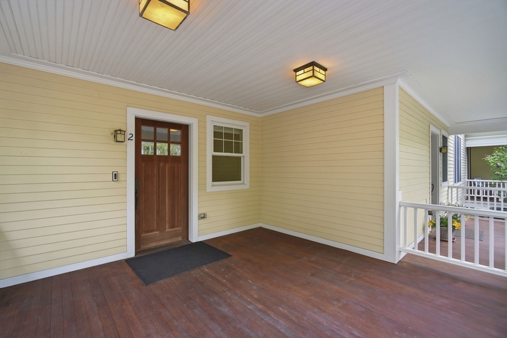 151 Amity Street, Unit 2 Amherst, MA 01002 - Photo 3 of 42 a view of a hallway with wooden floor and a window
