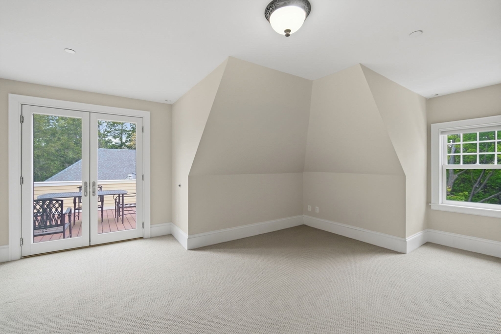151 Amity Street, Unit 2 Amherst, MA 01002 - Photo 31 of 42 an empty room with windows