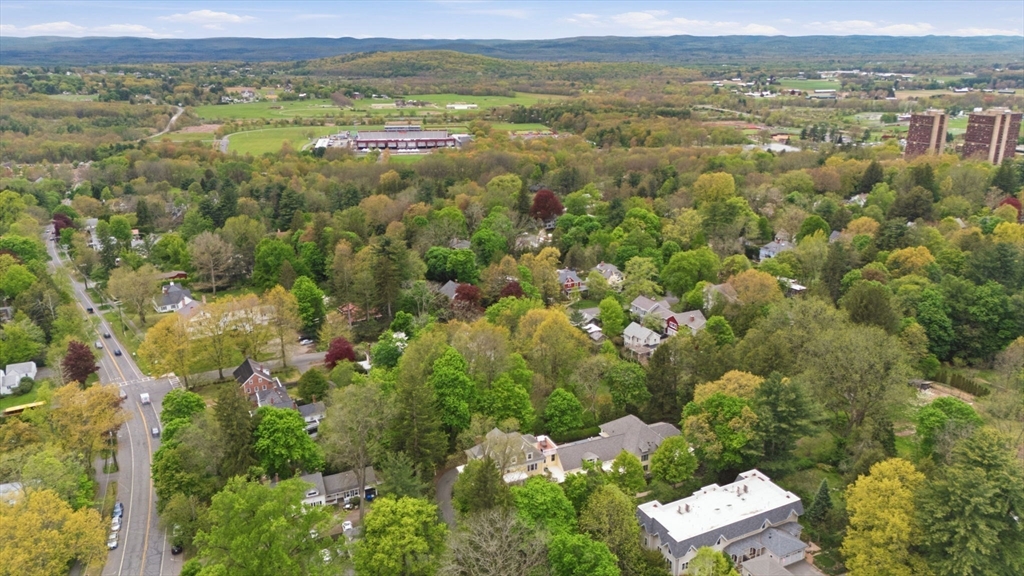 151 Amity Street, Unit 2 Amherst, MA 01002 - Photo 40 of 42 an aerial view of residential houses with outdoor space and trees