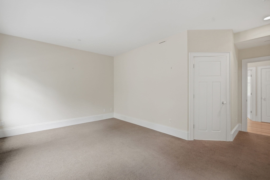 151 Amity Street, Unit 2 Amherst, MA 01002 - Photo 7 of 42 a view of an empty room
