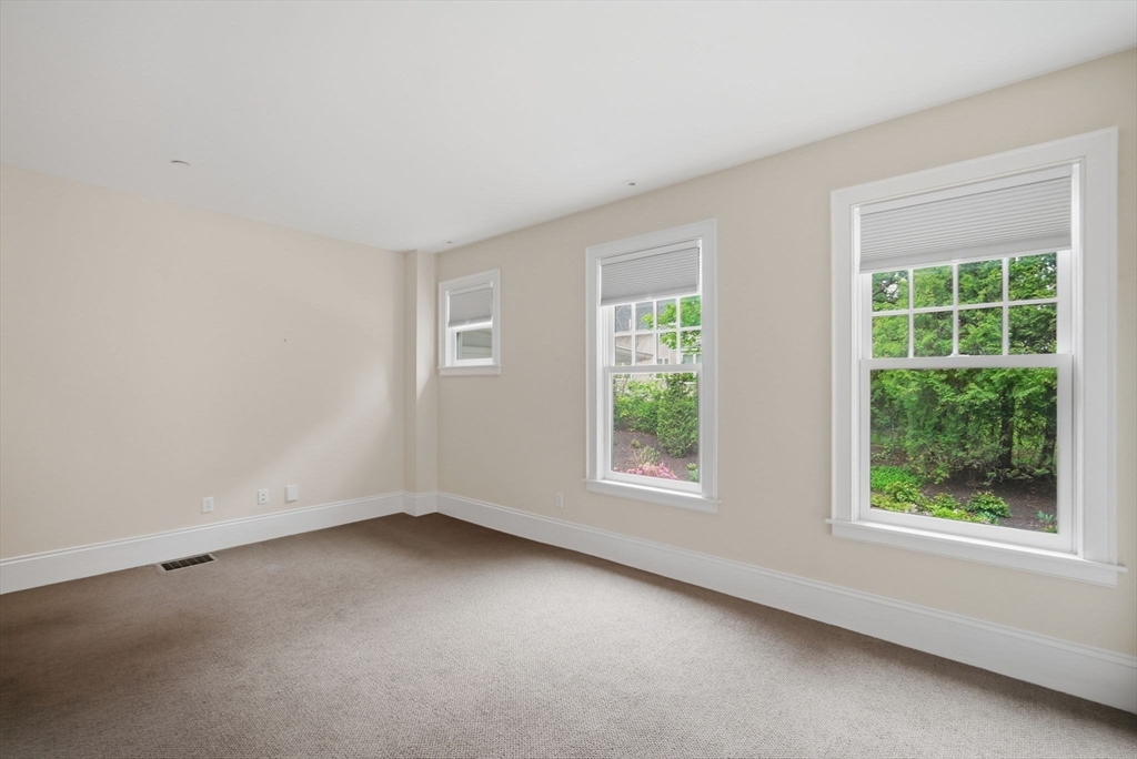 151 Amity Street, Unit 2 Amherst, MA 01002 - Photo 8 of 42 an empty room with windows