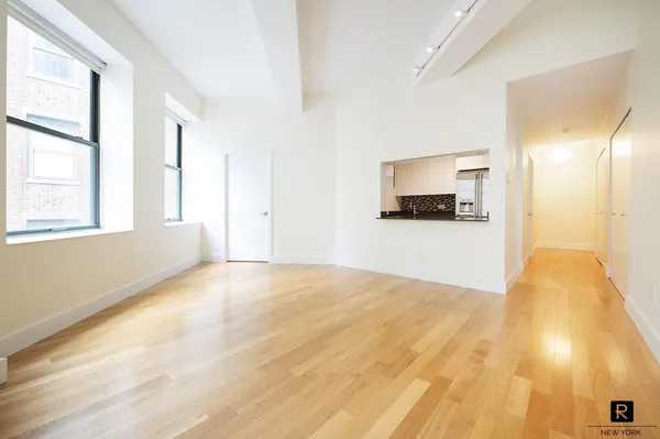 a view of a kitchen with a sink and a window