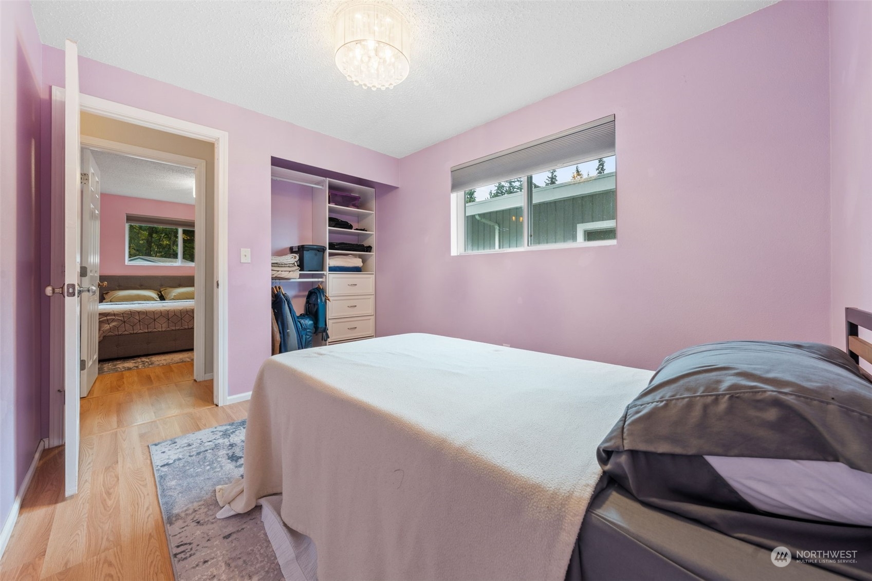 2746 Northeast 24th Street Renton, WA 98056 - Photo 19 of 20 a bedroom with a bed and a view of kitchen