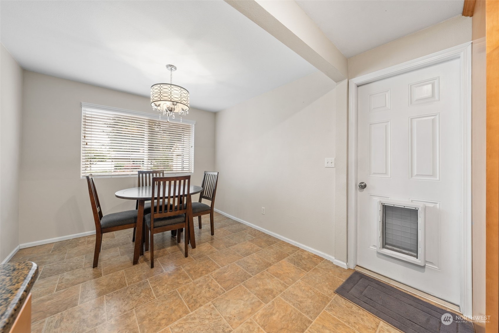 2746 Northeast 24th Street Renton, WA 98056 - Photo 10 of 20 a dining room with a wooden table and chairs