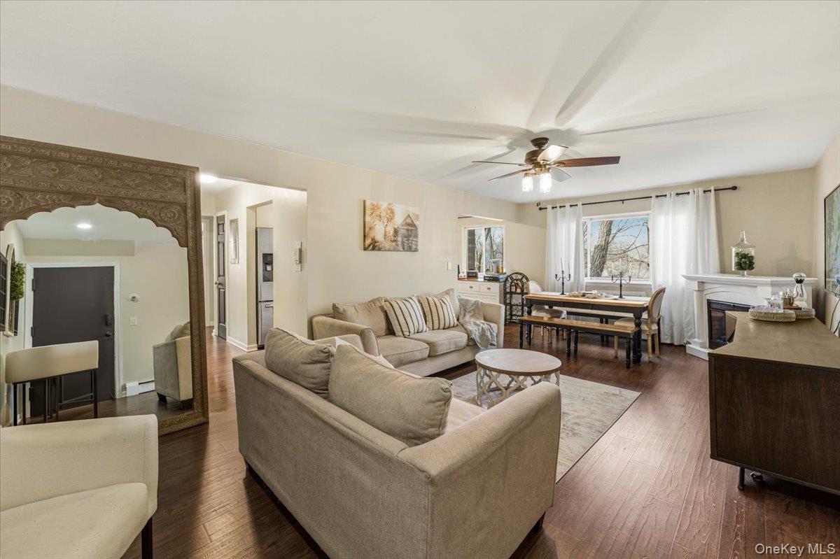 9 North James Street, Unit B Peekskill, NY 10566 - Photo 2 of 22 Living area with a fireplace, hardwood / wood-style floors, arched walkways, and ceiling fan