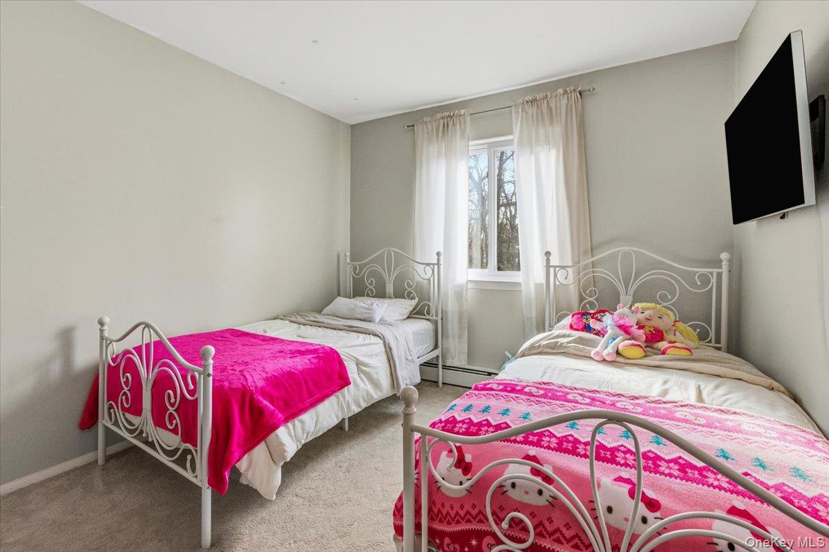 9 North James Street, Unit B Peekskill, NY 10566 - Photo 9 of 22 large bedroom featuring baseboard heating and baseboards