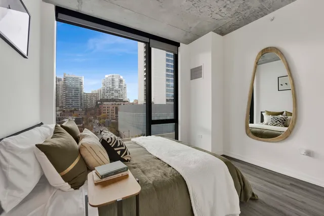 a bedroom with furniture and a window