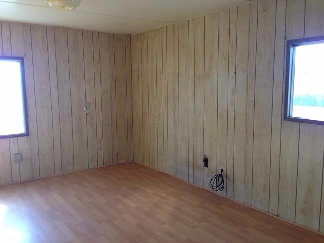 5821 Beagle Road White City, OR 97503 - Photo 17 of 28 a view of an empty room with wooden walls