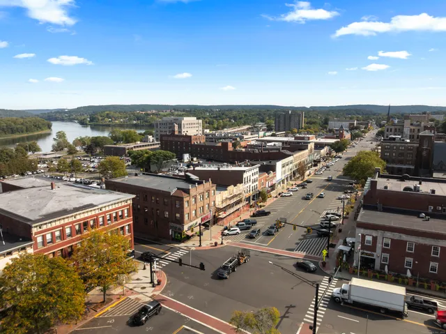an aerial view of a house with a ocean view