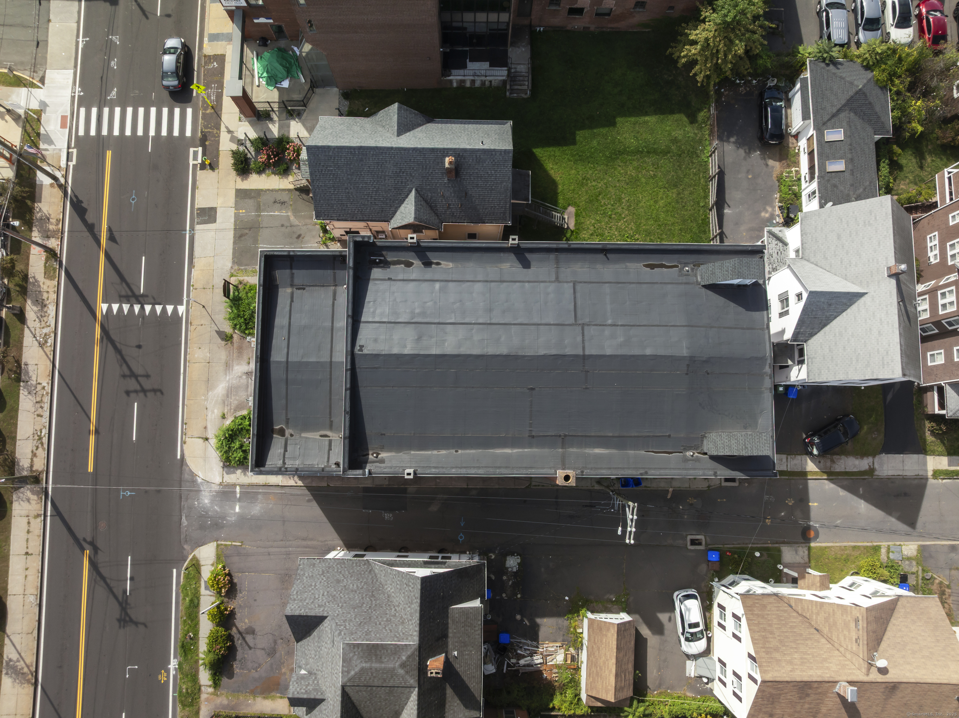 54 Washington Street Middletown, CT 06457 - Photo 4 of 19 an aerial view of a house with a garden and parking space