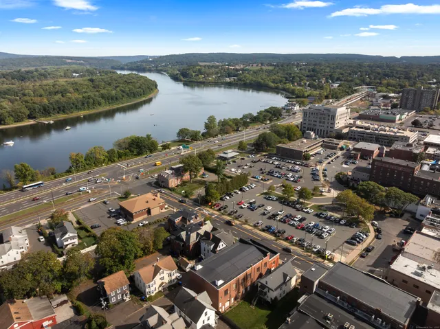 an aerial view of a city with ocean view