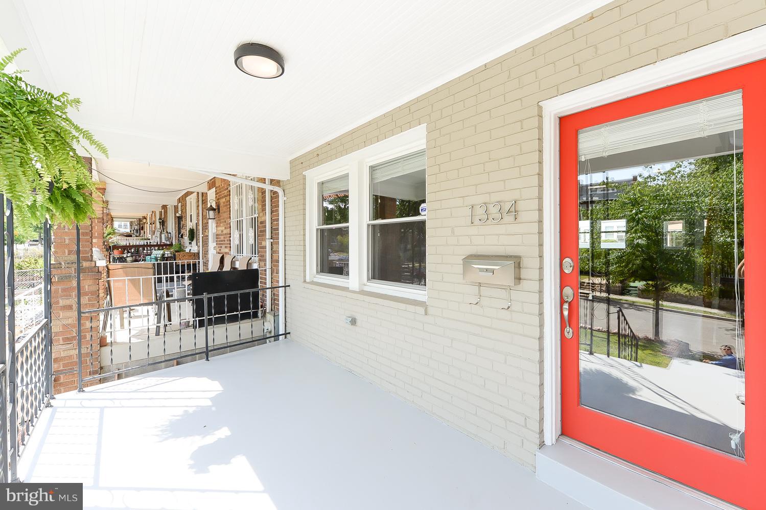 1334 Queen Street Northeast Washington, DC 20002 - Photo 2 of 29 a view of a building with a bench