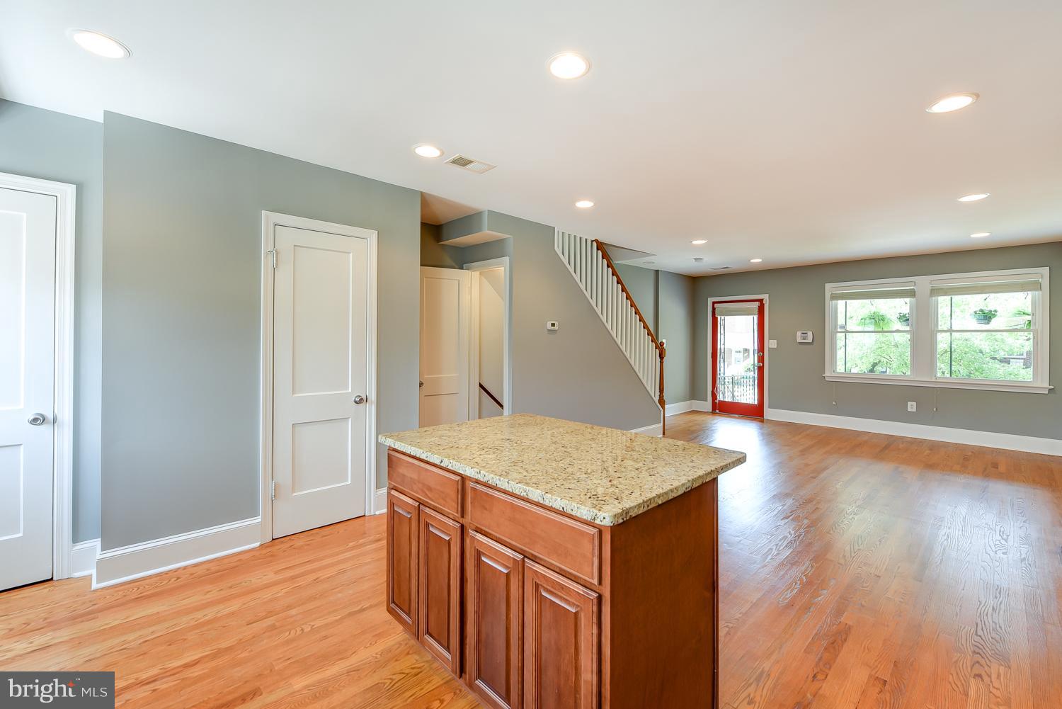 1334 Queen Street Northeast Washington, DC 20002 - Photo 11 of 29 an empty room with wooden floor and windows