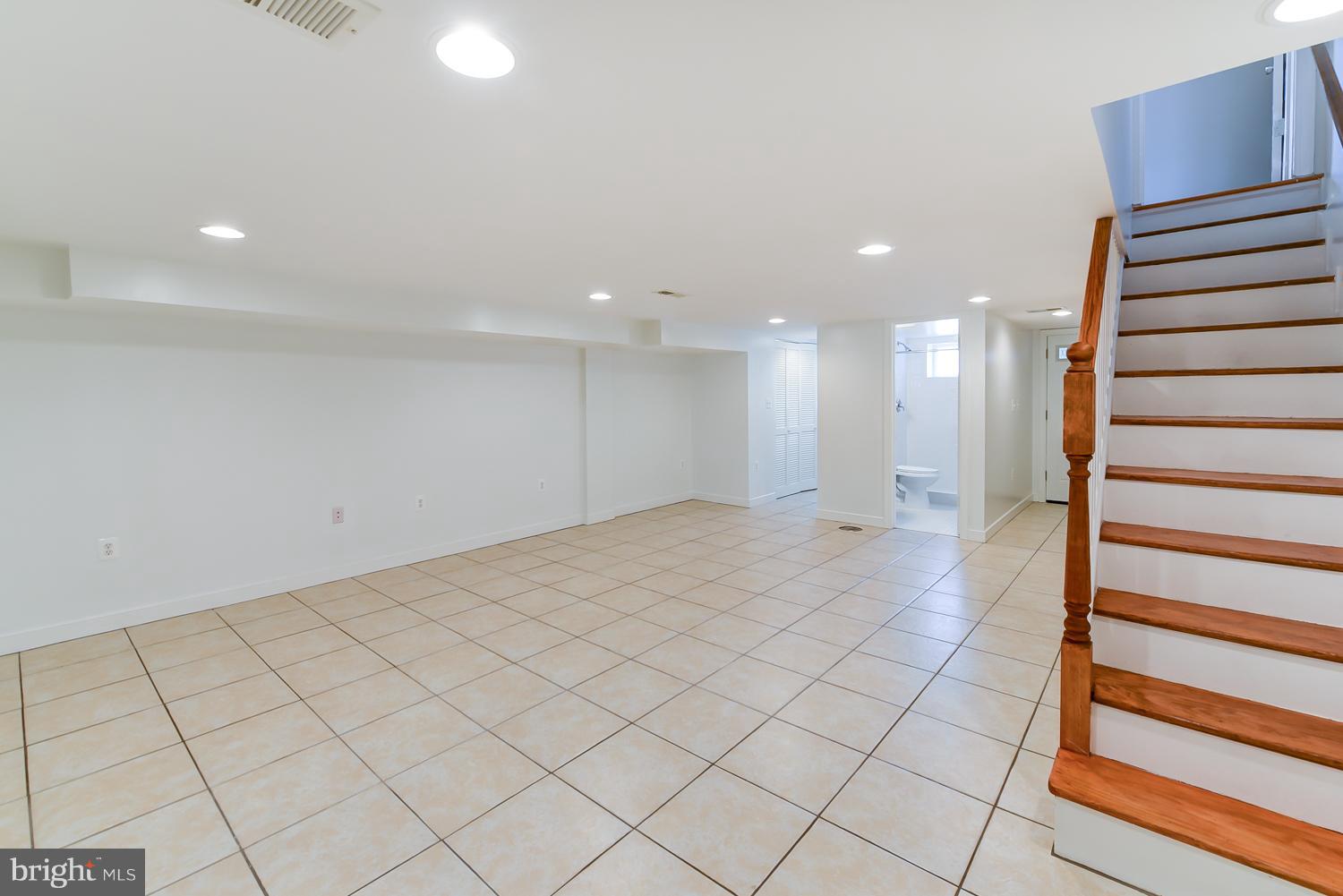1334 Queen Street Northeast Washington, DC 20002 - Photo 25 of 29 a view of a hallway with wooden floor