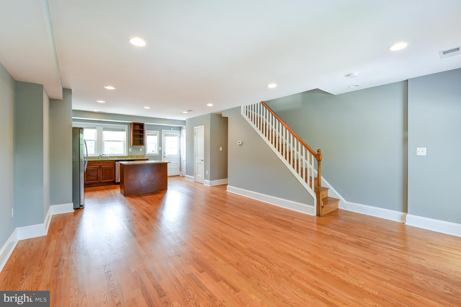 1334 Queen Street Northeast Washington, DC 20002 - Photo 4 of 29 a living room with furniture and wooden floor