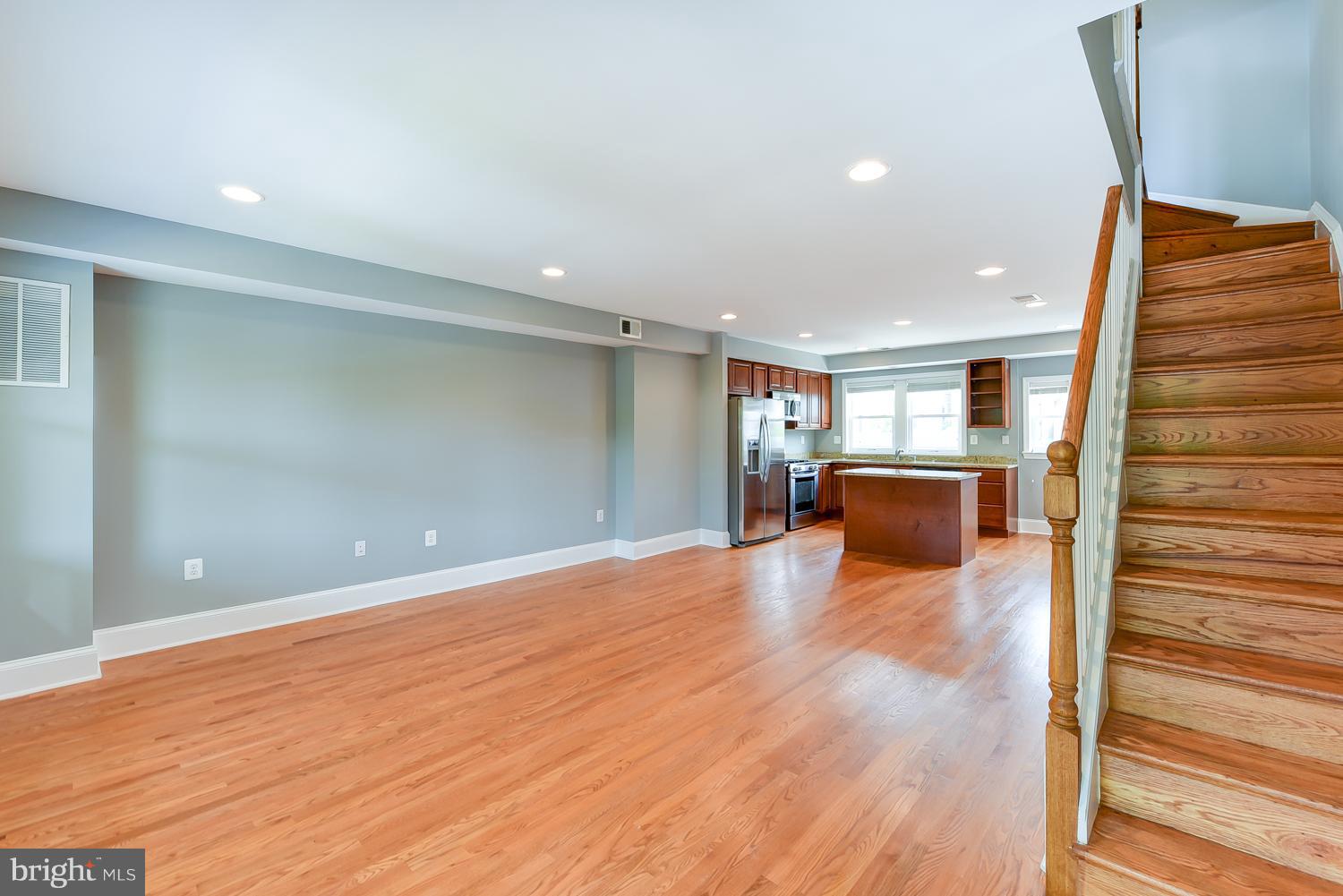 1334 Queen Street Northeast Washington, DC 20002 - Photo 6 of 29 a view of a livingroom with a furniture wooden floor and windows