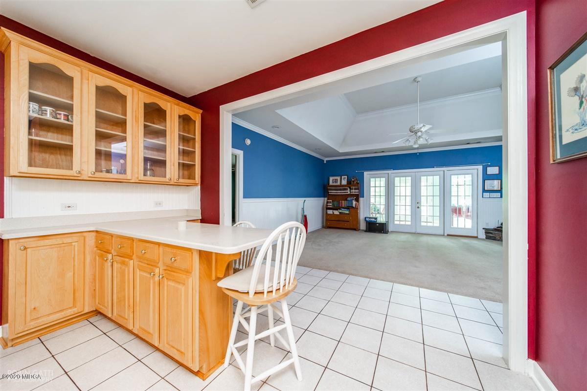 4271 Upper River Road Gray, GA 31032 - Photo 16 of 40 a view of a kitchen with furniture and windows