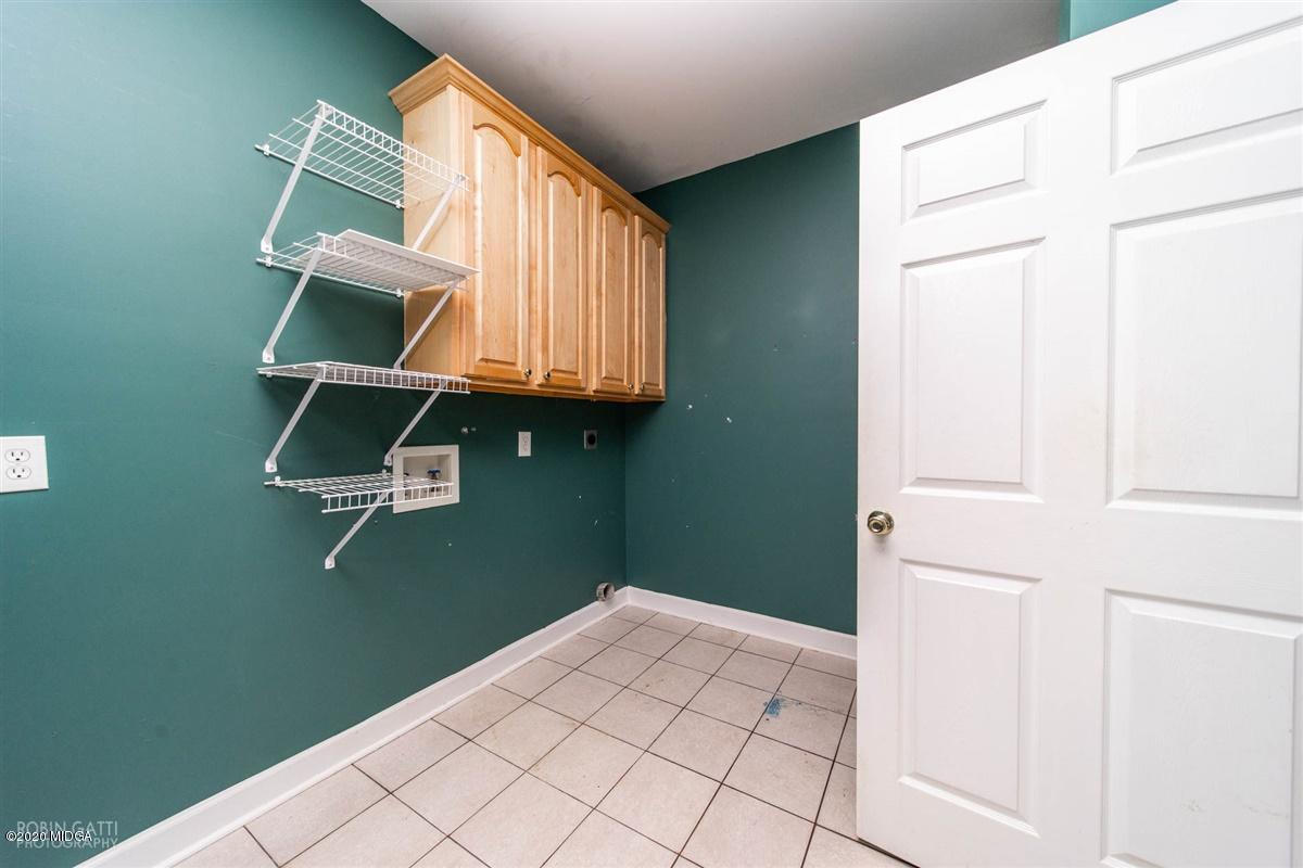 4271 Upper River Road Gray, GA 31032 - Photo 18 of 40 a room with washing machine and cabinets