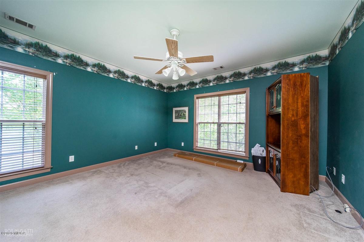 4271 Upper River Road Gray, GA 31032 - Photo 20 of 40 wooden floor and window in an empty room