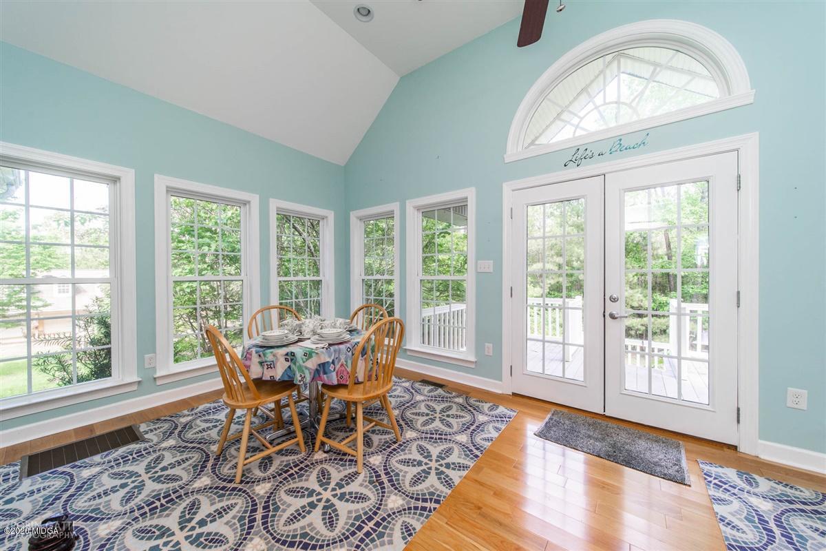 4271 Upper River Road Gray, GA 31032 - Photo 23 of 40 a view of a dining room with furniture window and wooden floor