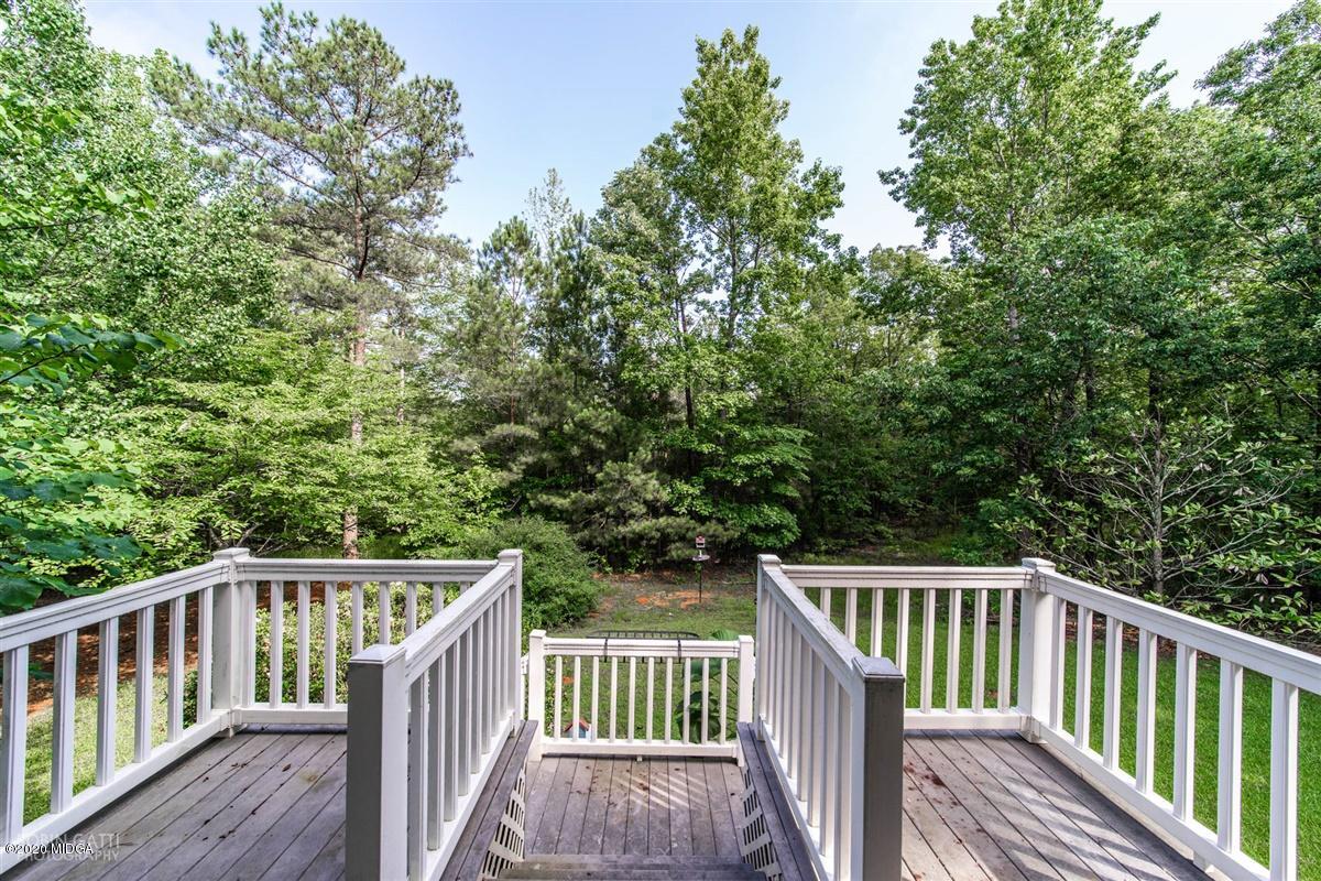 4271 Upper River Road Gray, GA 31032 - Photo 25 of 40 a view of balcony with wooden fence and trees