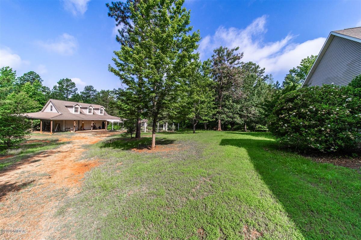 4271 Upper River Road Gray, GA 31032 - Photo 27 of 40 a view of a house with a yard